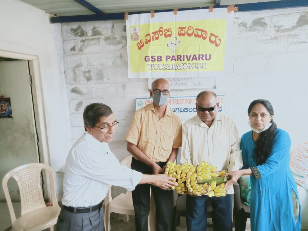 Distribution of N 95 masks, Sanitary pads, sanitizer and fruits to physically disy at Jnana Jyothi Kendra